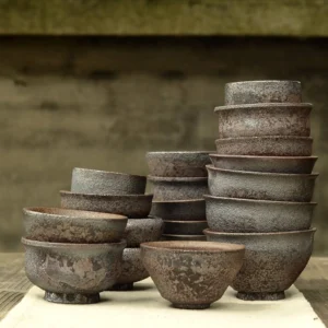 collection of vintage handmade rustic Chinese zisha clay tea bowls