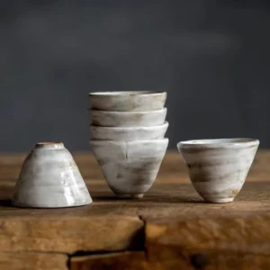 Set of 6 Japanese Wabi-Sabi porcelain tea cups stacked together
