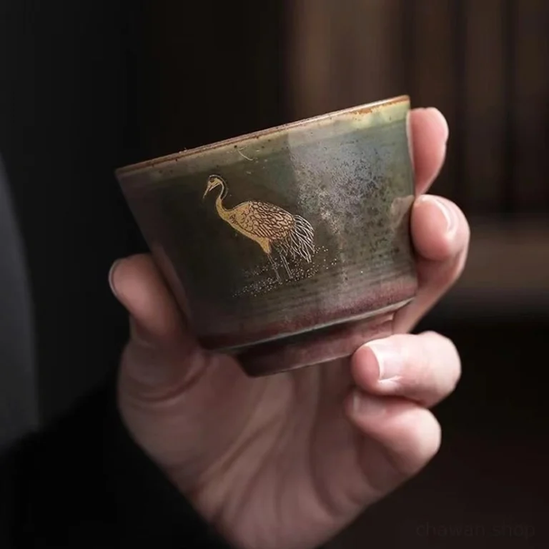 white glazed interior of handmade gold crane chinese tea cup