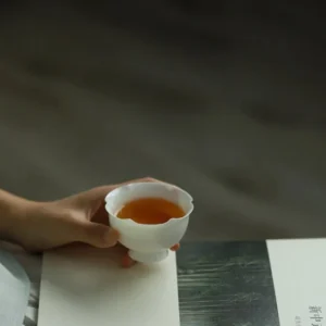 full product view of white lotus flower mouth mini porcelain chinese tea cup 1.5oz