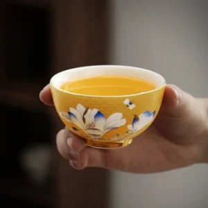Hand Painted Yellow Ceramic Chinese Tea Bowl with Magnolia and Gold Base Side View